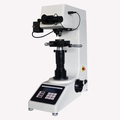 QA lab technician using a hardness tester machine to verify the material strength, durability, and load resistance of a custom manufactured brass component.